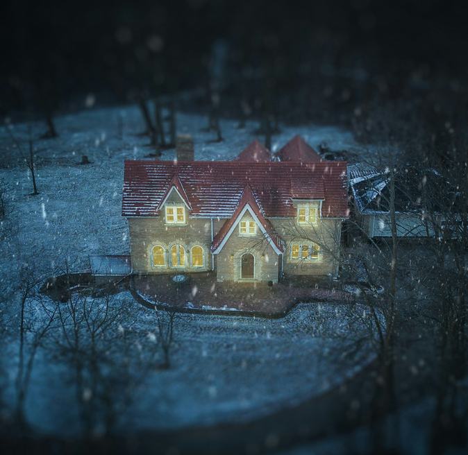 A house with every window glowing warm at night on battery backup